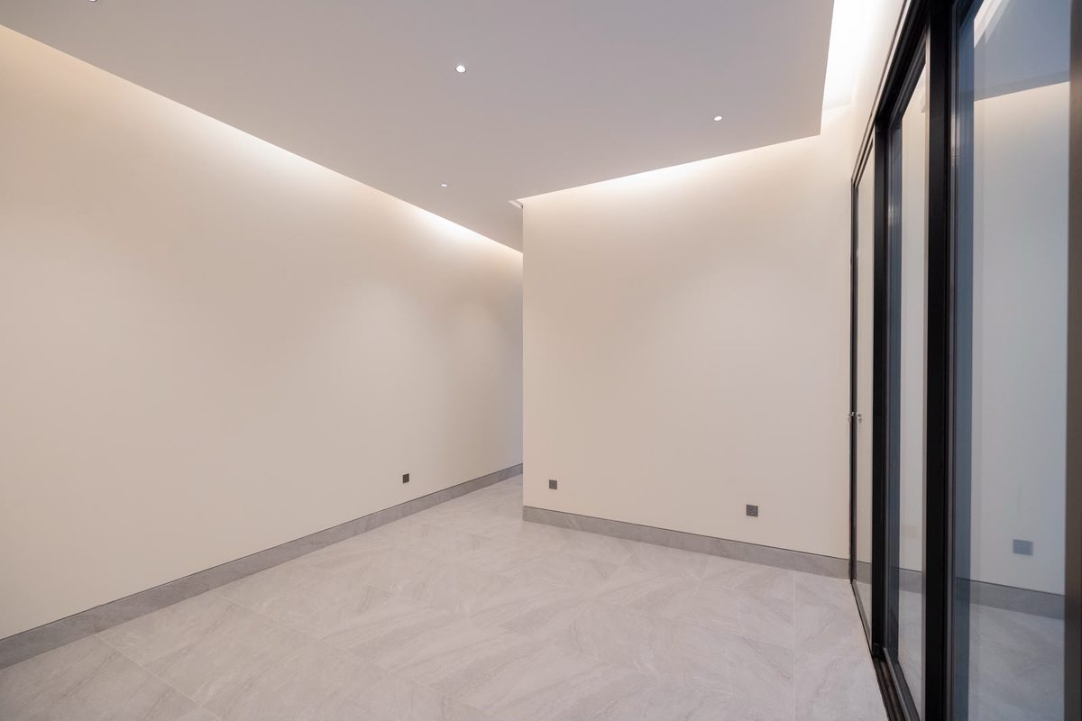 Bedroom with a full-height glazed window